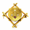Ancient gold brooch in an anchor design studded with pearls and rubies