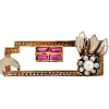 A gold brooch with a unique geometric design studded with diamonds, rubies and pearls